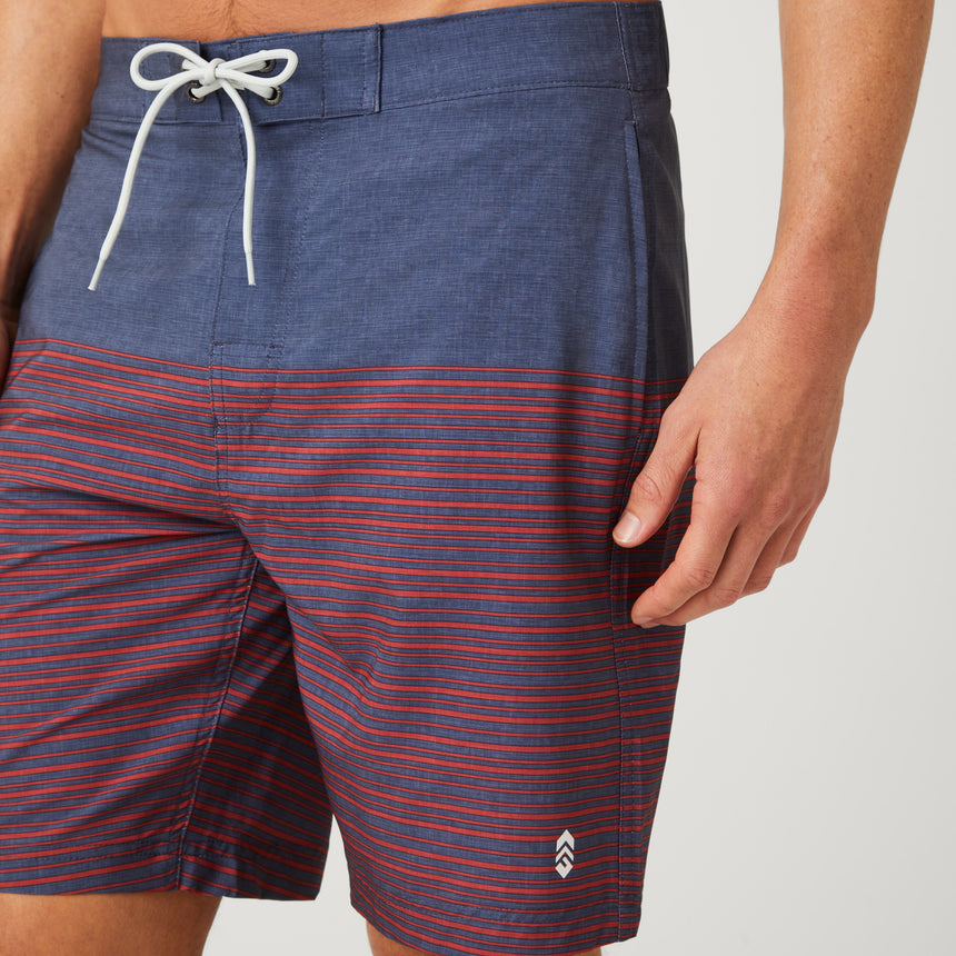 [Model is wearing a size Medium.] Men's Lake Side Stripe Surf Short - Redrock #color_redrock