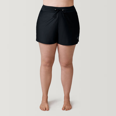[Model is 5’10” wearing a size 1X] Women's Plus Size Drawstring Swim Short - Black #color_black