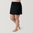 [Model is 5’10” wearing a size 1X] Women's Plus Size Bermuda Skort - Black - 1X #color_black