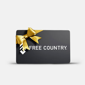A Free Country Gift Card featuring a black design with a gold bow in the top left and "FREE COUNTRY" in white on a light gray background—ideal for sharing the Gift of the Outside. Brand: Free Country.